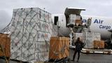 A consignment of USAID medical equipment is offloaded at the Roberts International Airport in Monrovia, August 24, 2014, photo by James Giahyue/Reuters