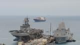The USS <em>Bonhomme Richard</em>, left, and USS <em>Green Bay</em> docked at White Beach Naval Facility, Okinawa, Japan, March 5, 2015, photo by Lt. David Levy/U.S. Navy