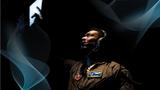 An individual in a U.S. Air Force uniform uses an overhead touch screen
