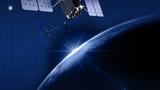 A satellite orbits the earth as a source of bright white light becomes visible behind it