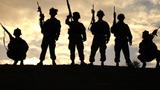 Soldiers from Battery B, 3rd Battalion, 320th Field Artillery Regiment, 101st Airborne Division, pause at the end of a patrol near Wynot, Iraq, October 6, 2005, photo by U.S. Army