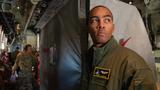 Capt. Cedric Parker inspects cargo on a C-130J Super Hercules at Yokota Air Base, Japan, February 6, 2023, photo by A1C Brooklyn Golightly/U.S. Air Force