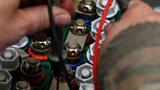 A soldier's hands on a battery, photo by Staff Sgt. Sarah M. McClanahan/U.S. Air Force