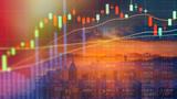 Double exposure of stock market chart on LED display concept over a cityscape of Hong Kong, image by namning/Adobe Stock