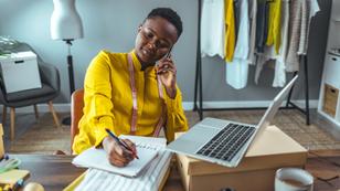 Young Black entrepreneur working in her office, photo by ljubaphoto/Getty Images
