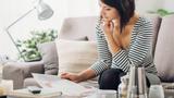 Woman on the couch reading a magazine, photo by StockPhotoPro/Adobe Stock
