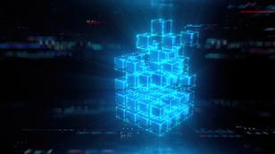 Blue glowing cubes forming a larger cube on a black background, image by da-kuk/Getty Images