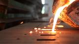 Molten iron pouring into a mold, photo by Warut Sintapanon/Adobe Stock