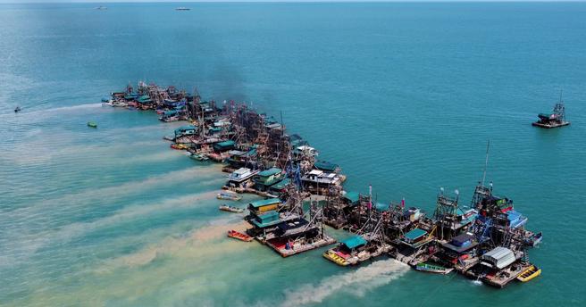 An aerial view of wooden pontoons equipped to dredge the seabed for deposits of tin ore off the coast of Toboali, on the island of Bangka, Indonesia, May 1, 2021, photo by Willy Kurniawan/Reuters